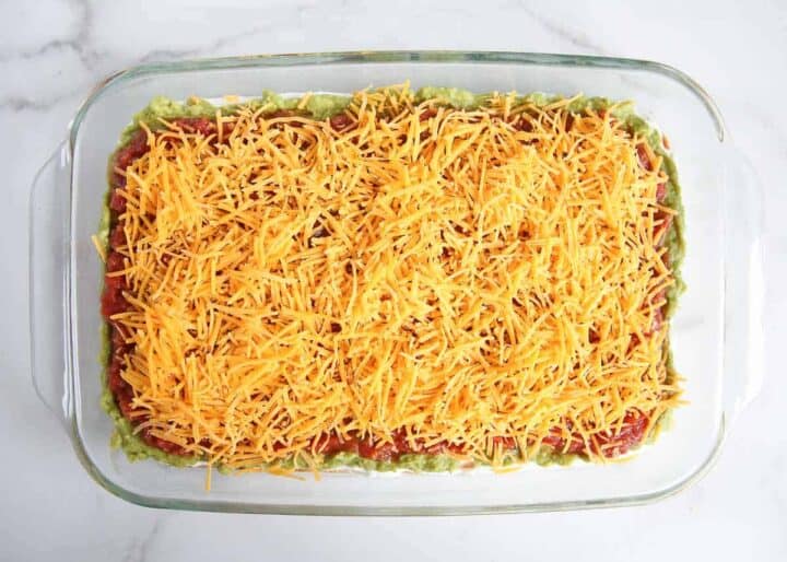 Cheese on top of salsa for 7 layer dip.