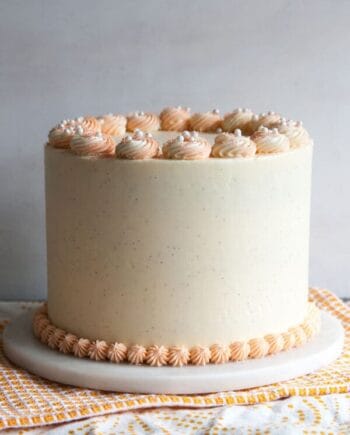 orange creamsicle cake sitting on top of a table