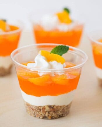 orange pretzel parfait in a small plastic cup