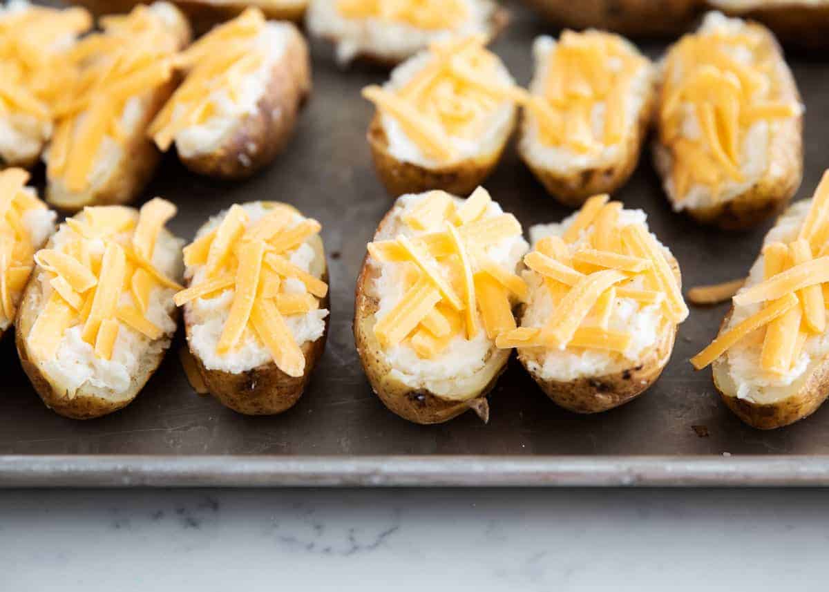 Potato shells stuffed with mashed potatoes and topped with cheese.