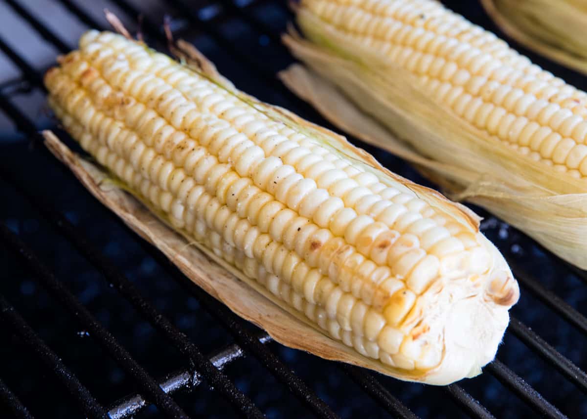 Grilled corn in the husk.