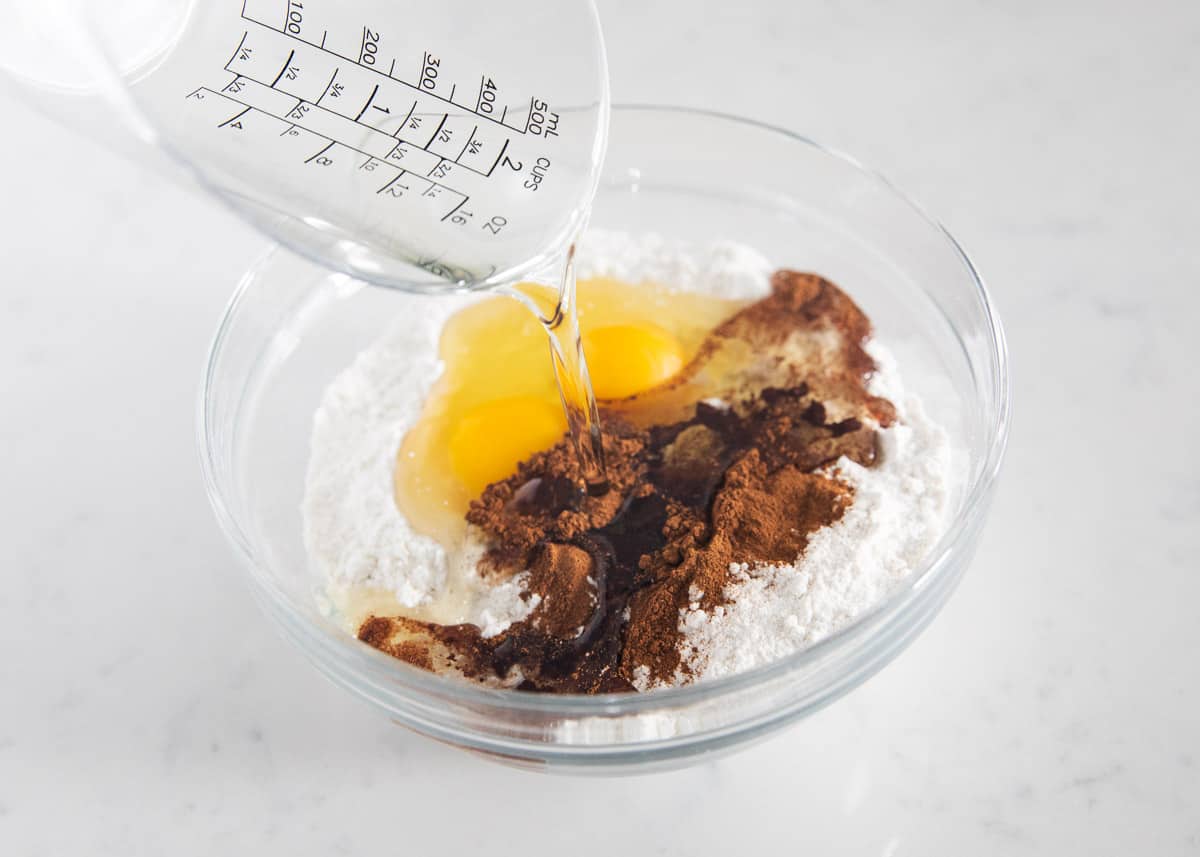 Snickerdoodle cake mix cookies ingredients in bowl.