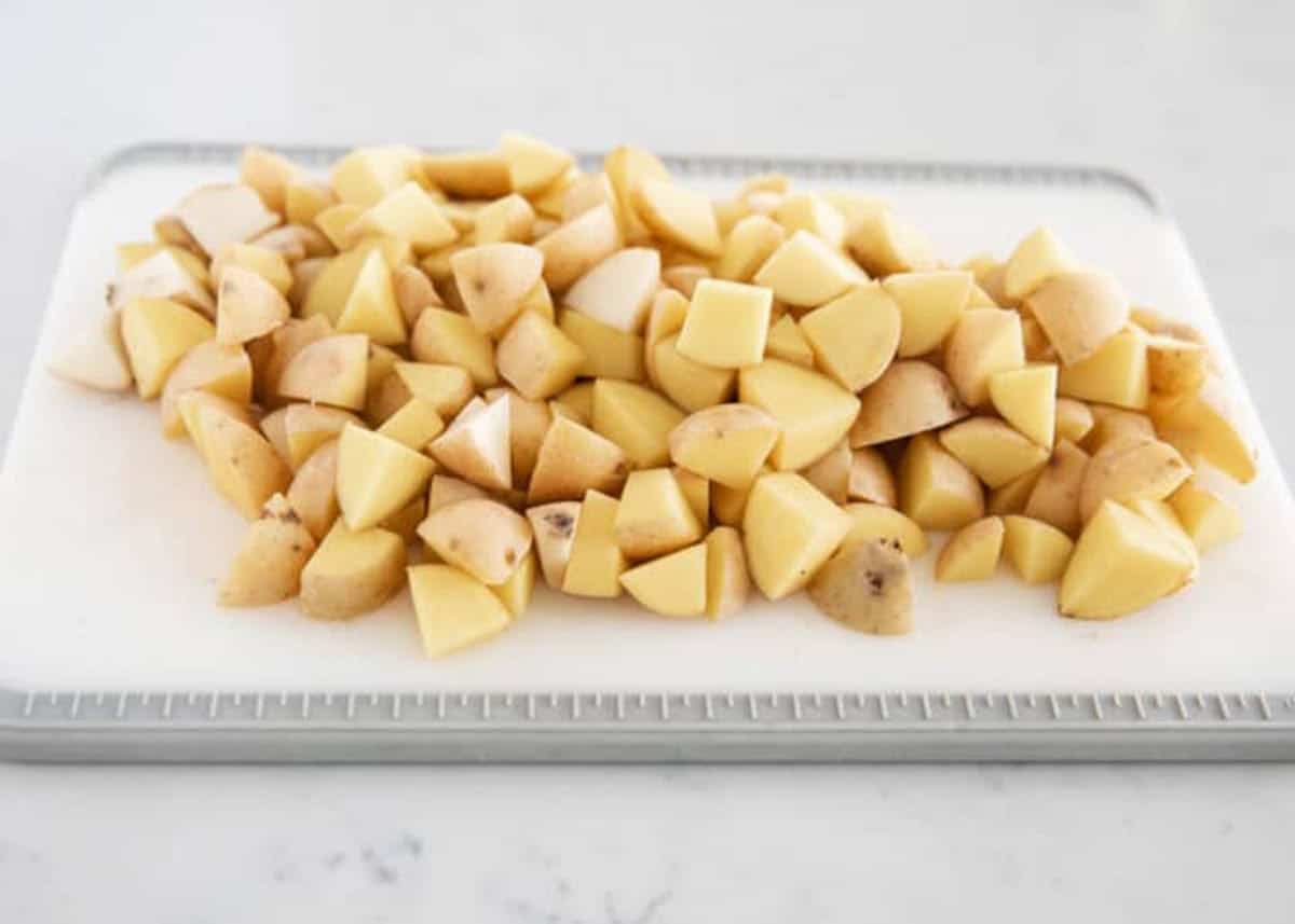 Diced potatoes on a cutting board.