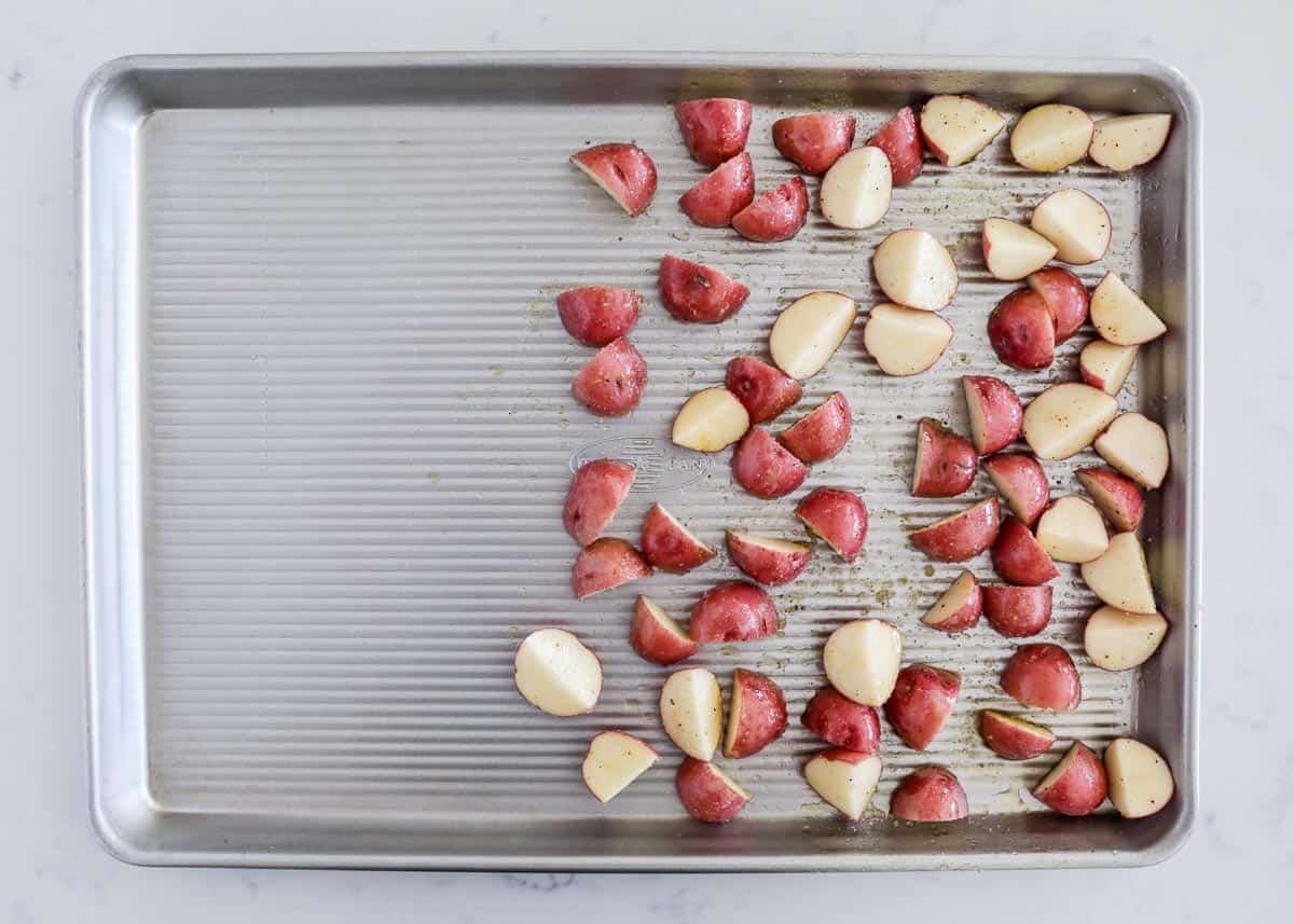 Red potatoes on pan.