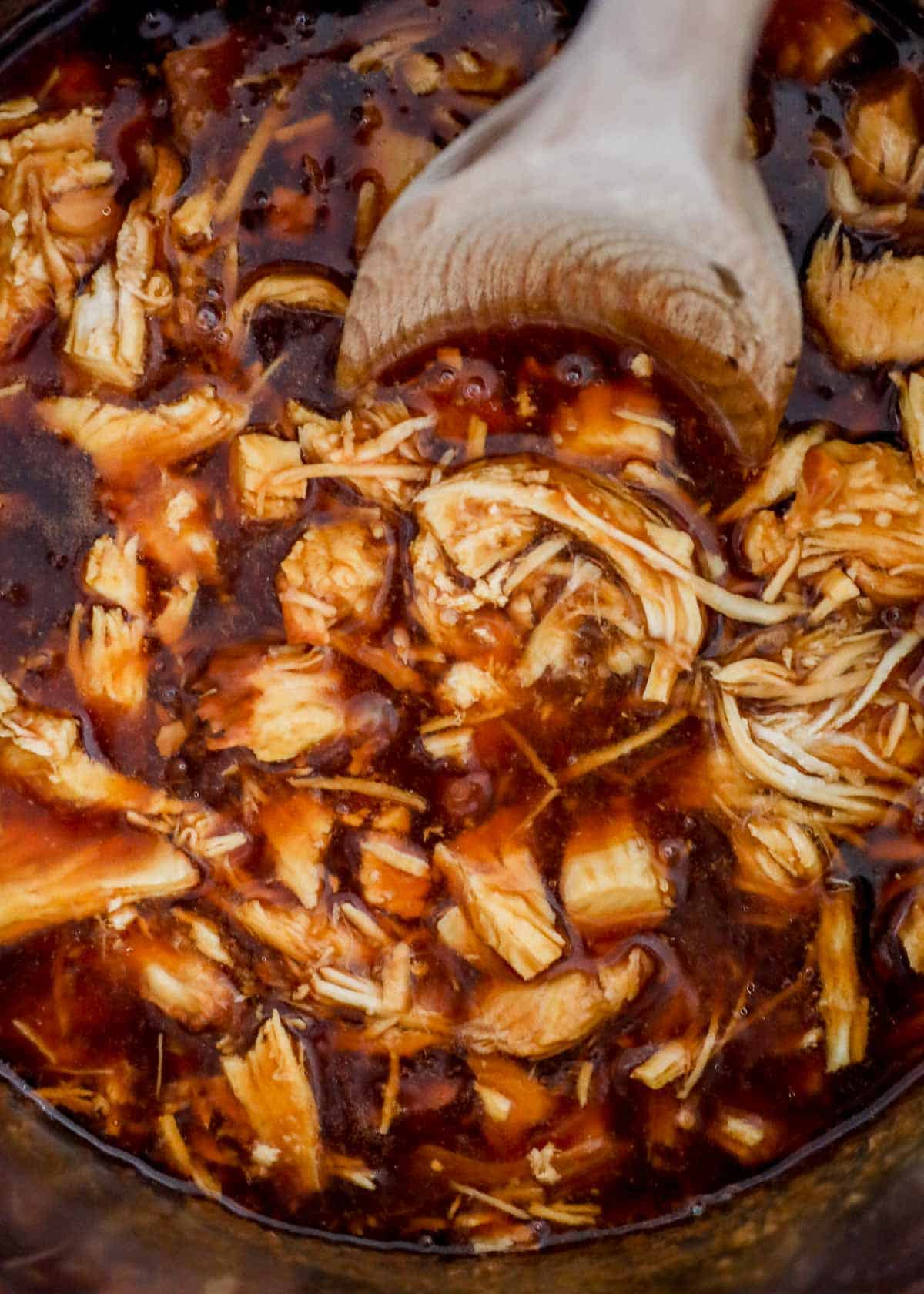 Instant Pot teriyaki chicken with a serving spoon.