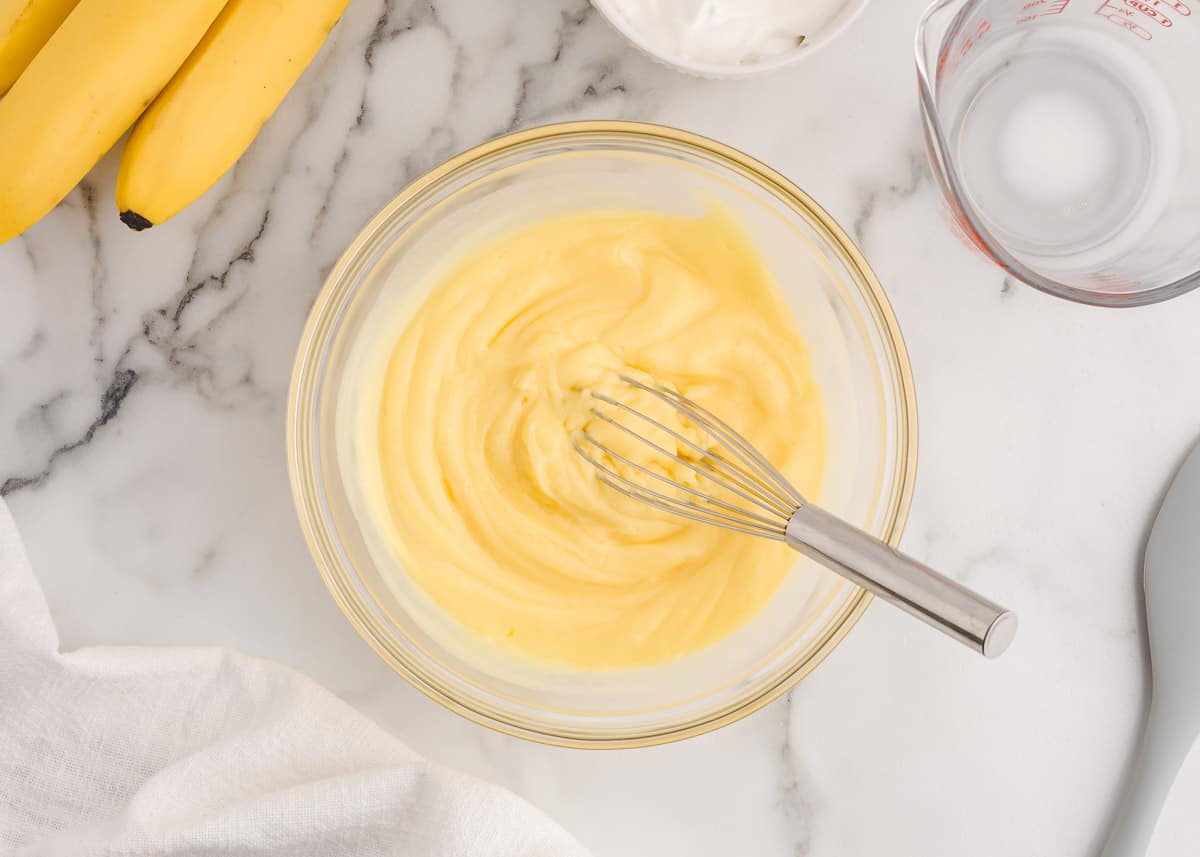 Mixing pudding in bowl.