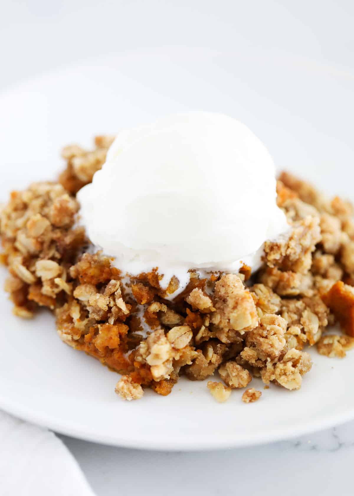 pumpkin crisp with ice cream on plate