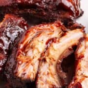 Slow cooker ribs sliced on a plate.