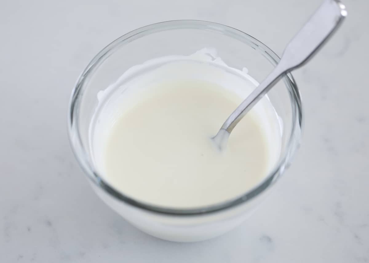 Melted white chocolate in a bowl.