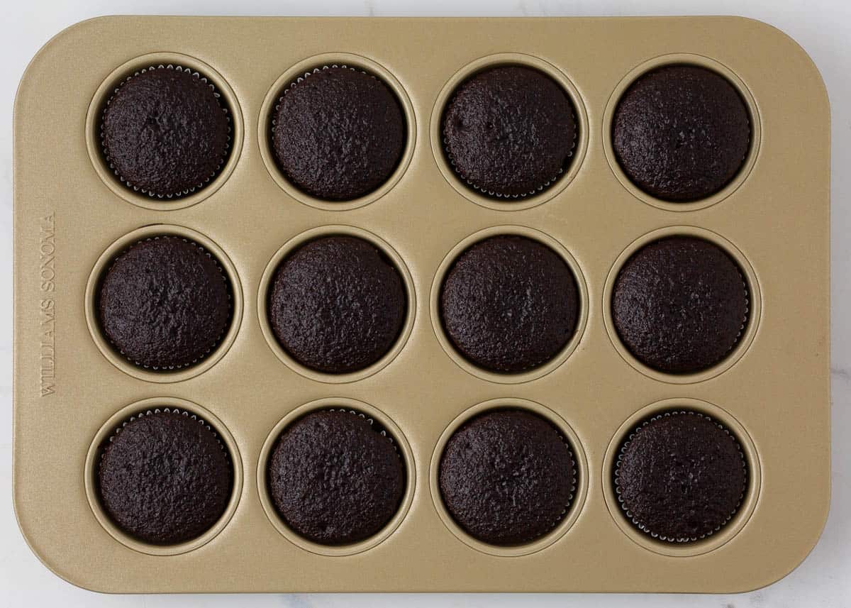 Chocolate cupcakes in muffin tin.