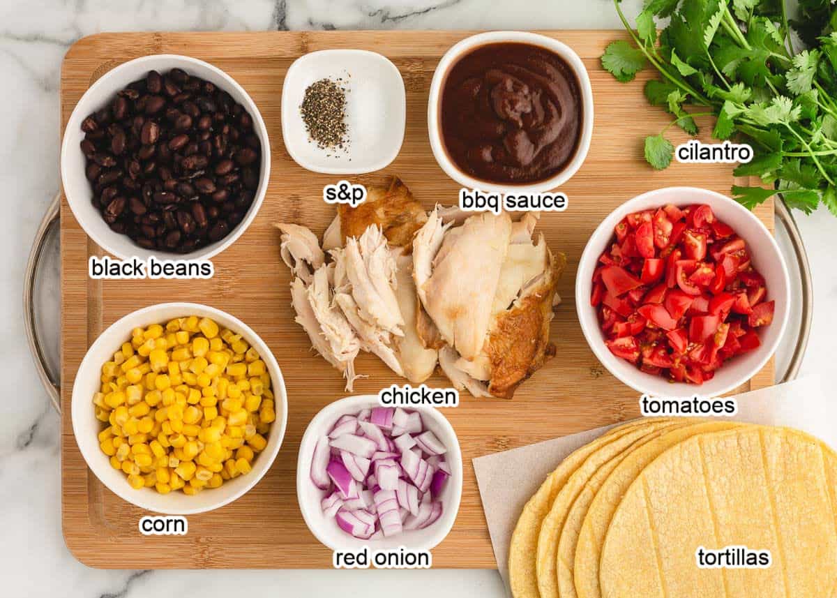 Ingredients on a cutting board for BBQ chicken salad.