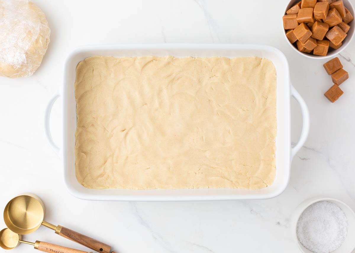 Shortbread crust in a baking dish.