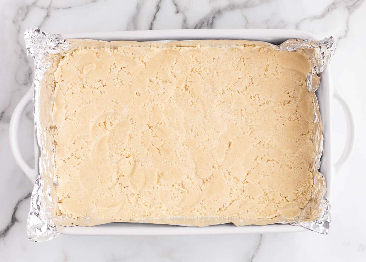 Shortbread crust pressed into a 9x13 baking dish.