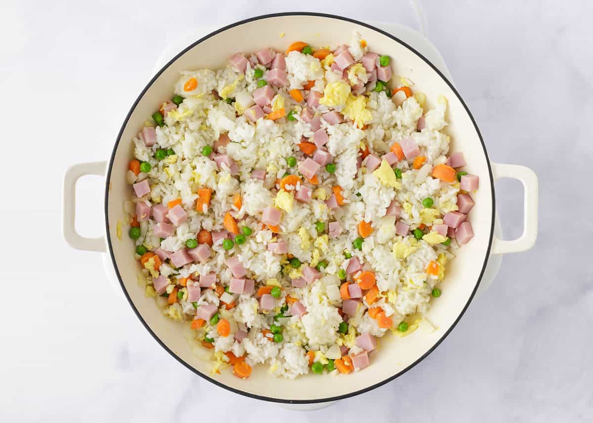 White rice, veggies and ham in a skillet.