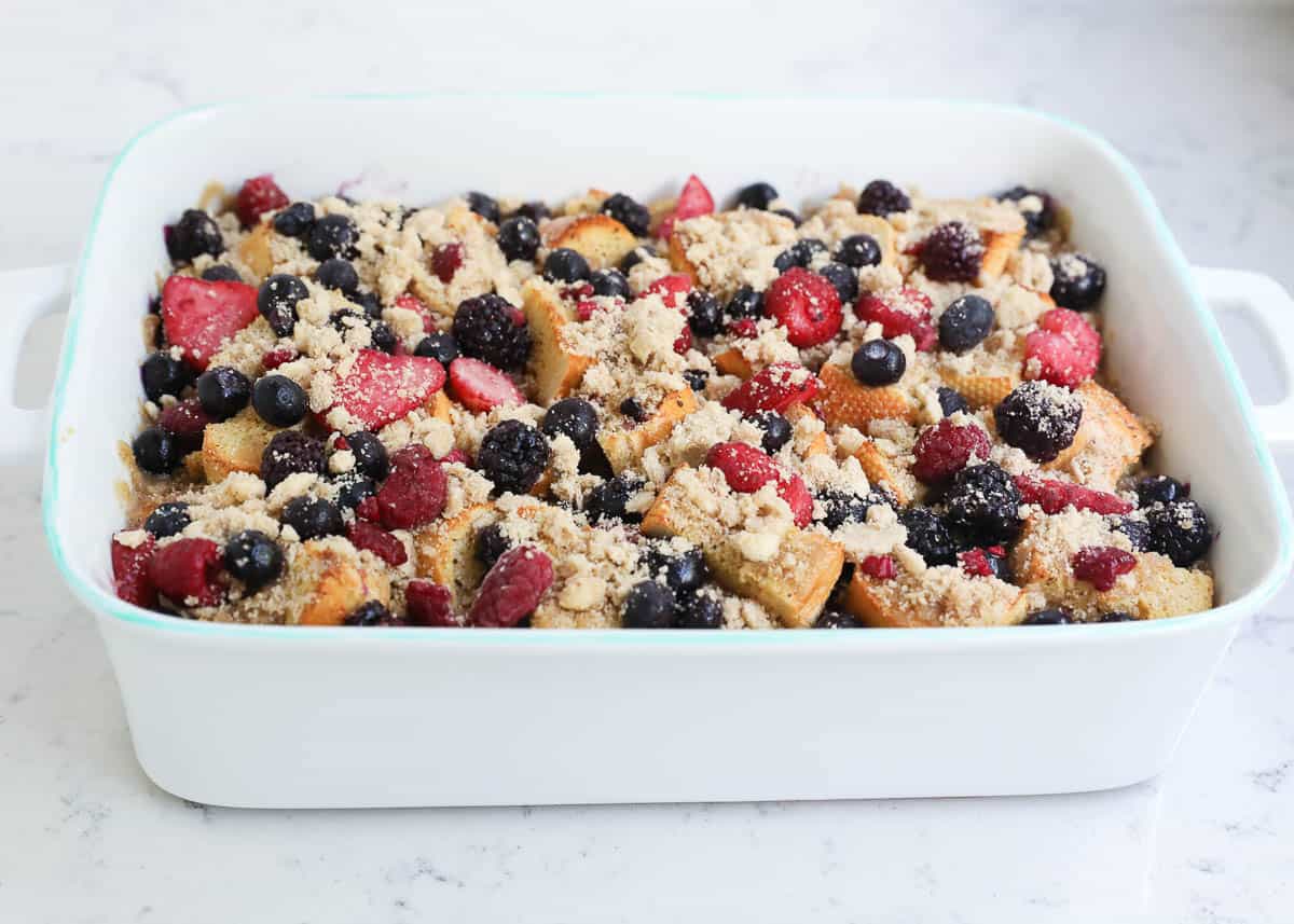 Crumble topping and berries on top of french toast casserole.