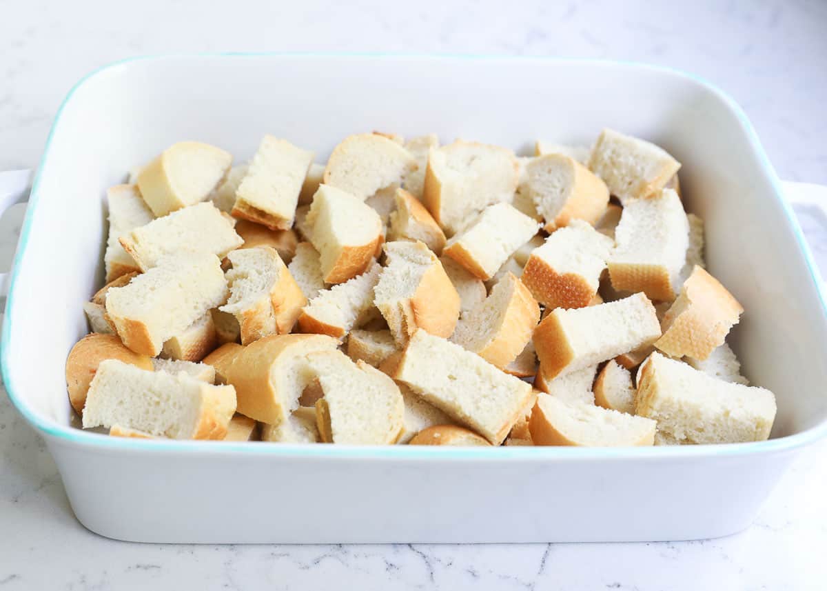 Bread cubes in baking dish.