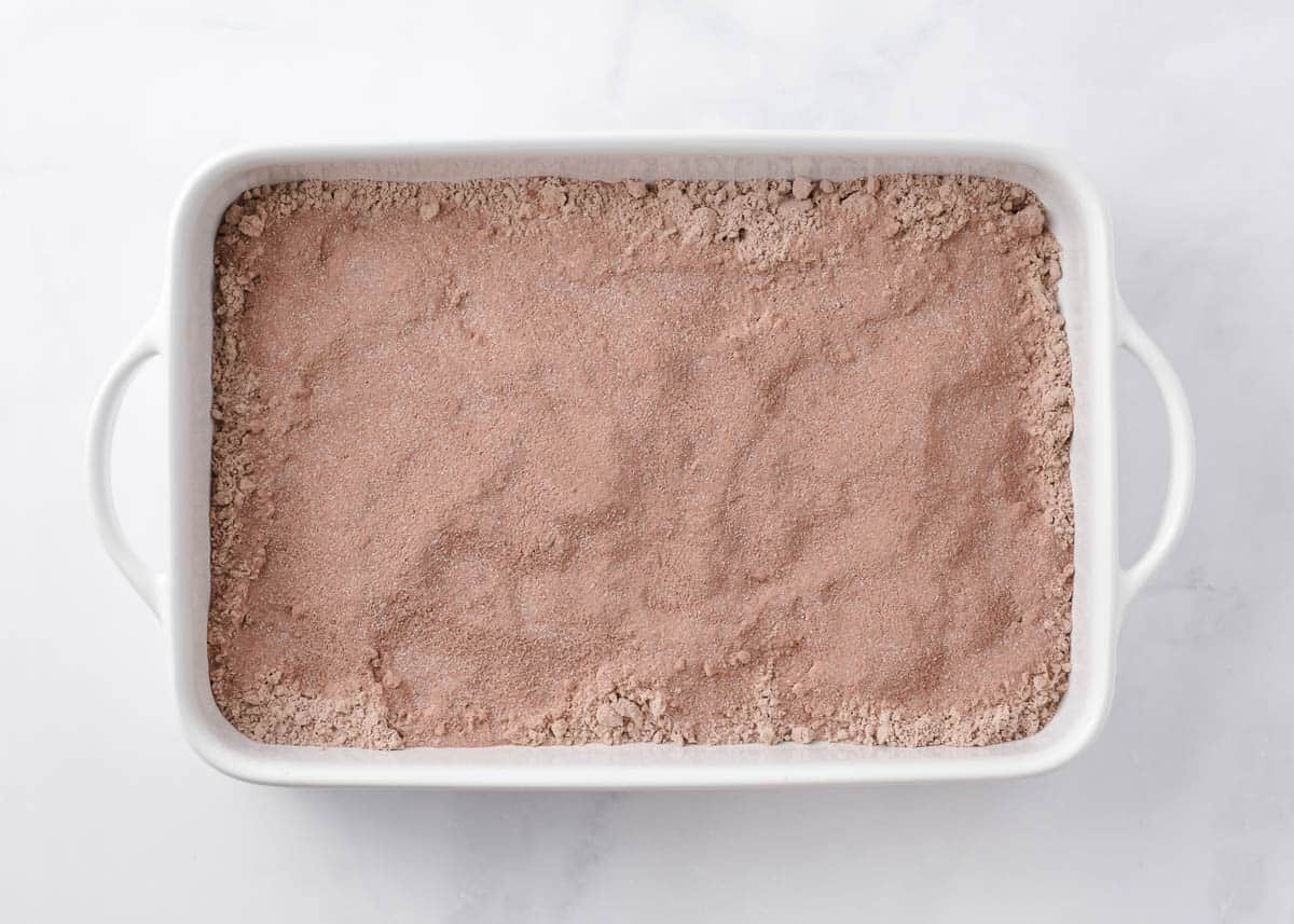 Dry chocolate cake mix and instant chocolate pudding in a pan.