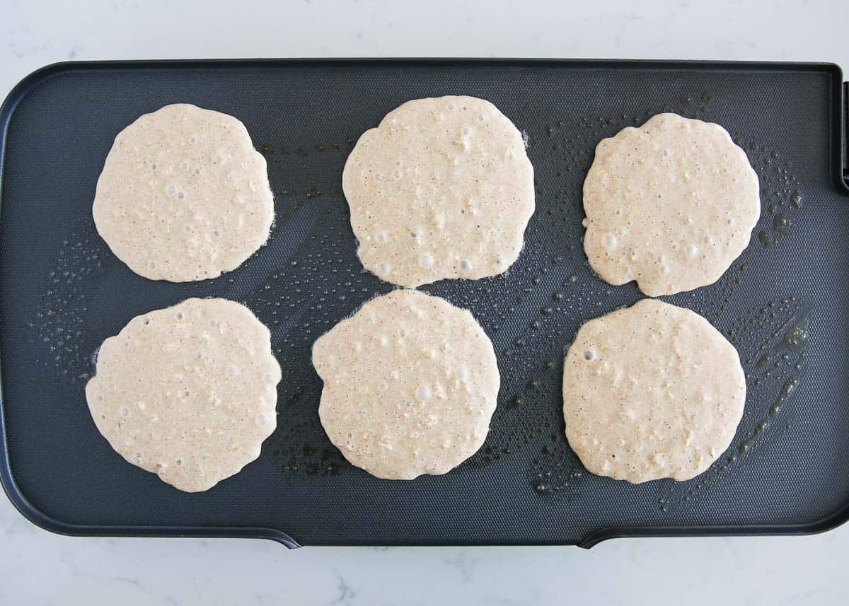 Blender oatmeal pancakes on the griddle.