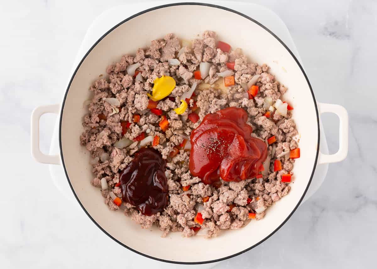 Ground turkey, bell pepper, onion, ketchup, BBQ sauce and seasonings in a skillet.