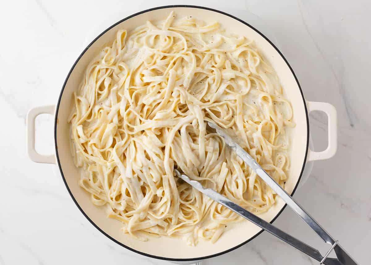 Fettuccini noodles tossed with alfredo sauce with cream cheese. 