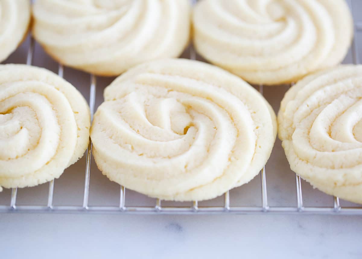 Butter cookies on wire cooling rack.