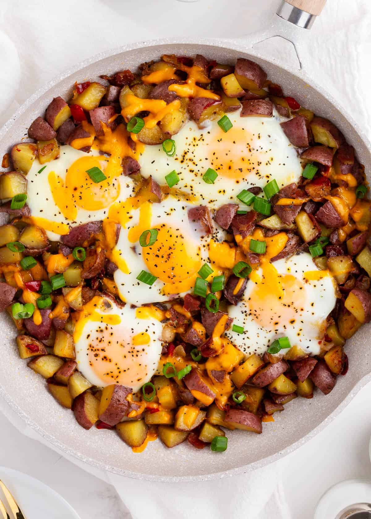 Egg skillet for breakfast with potatoes, eggs and bacon.