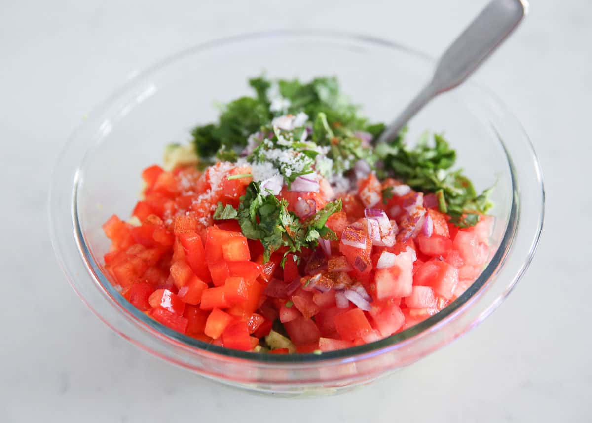 Avocado salsa ingredients in a bowl.