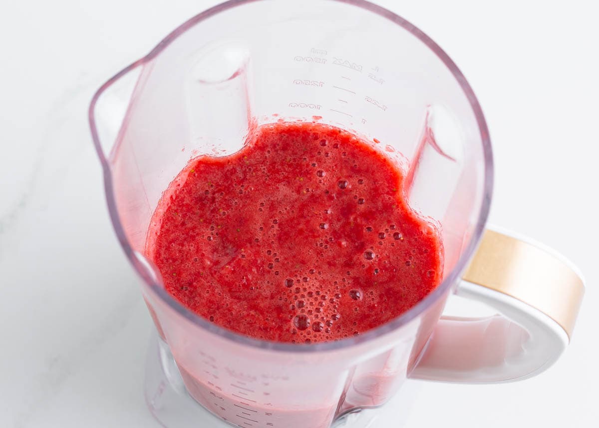 Pureed strawberries in blender.