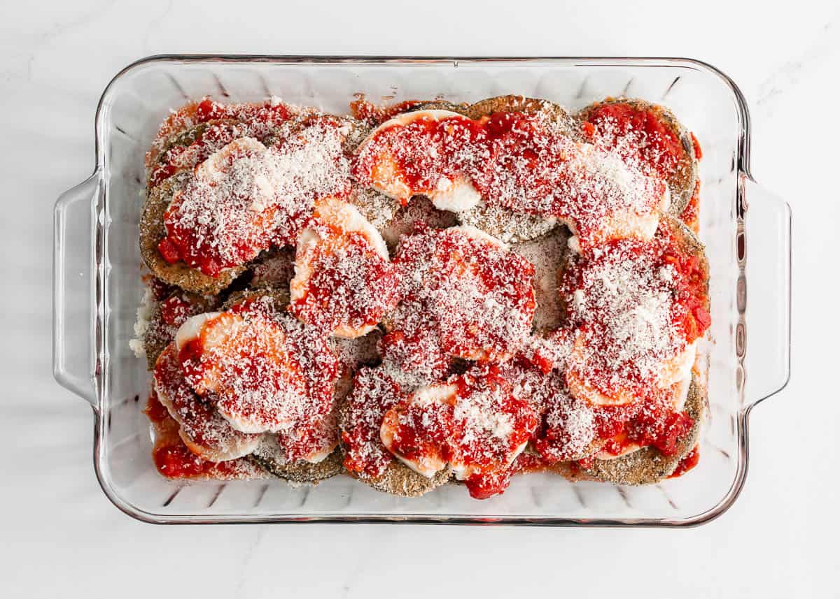 Assembled eggplant parmesan ready to be baked.