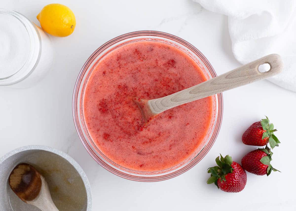 Strawberries with pectin setting in a bowl.