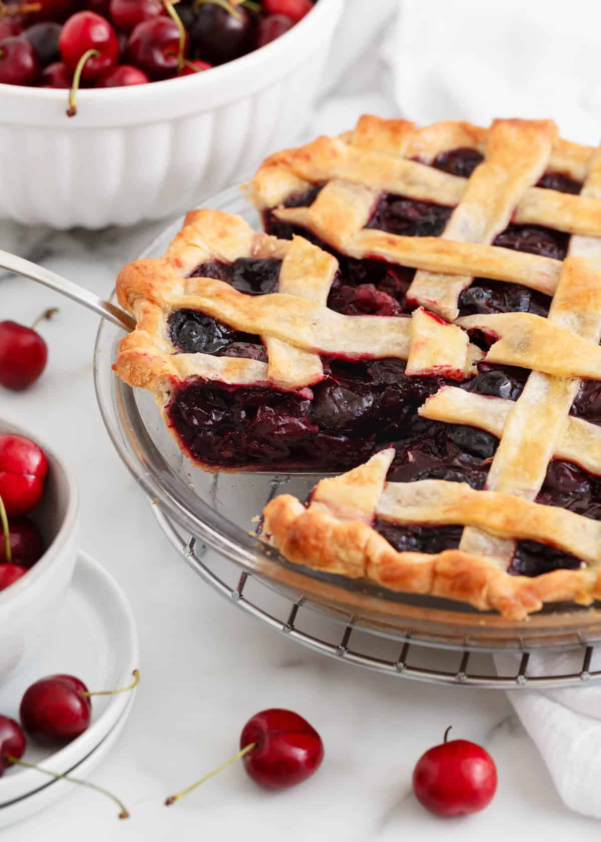 A slice of cherry pie being served.