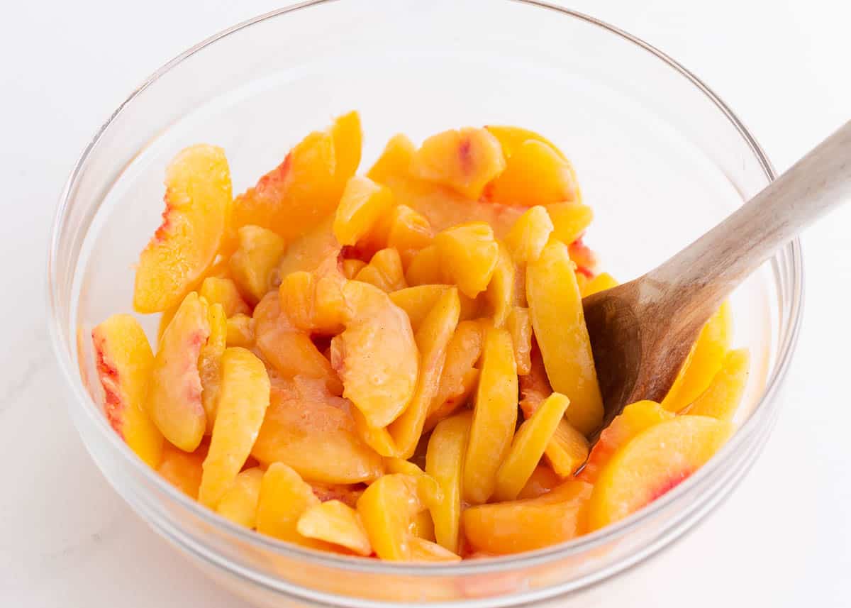 Sliced peaches in a bowl.