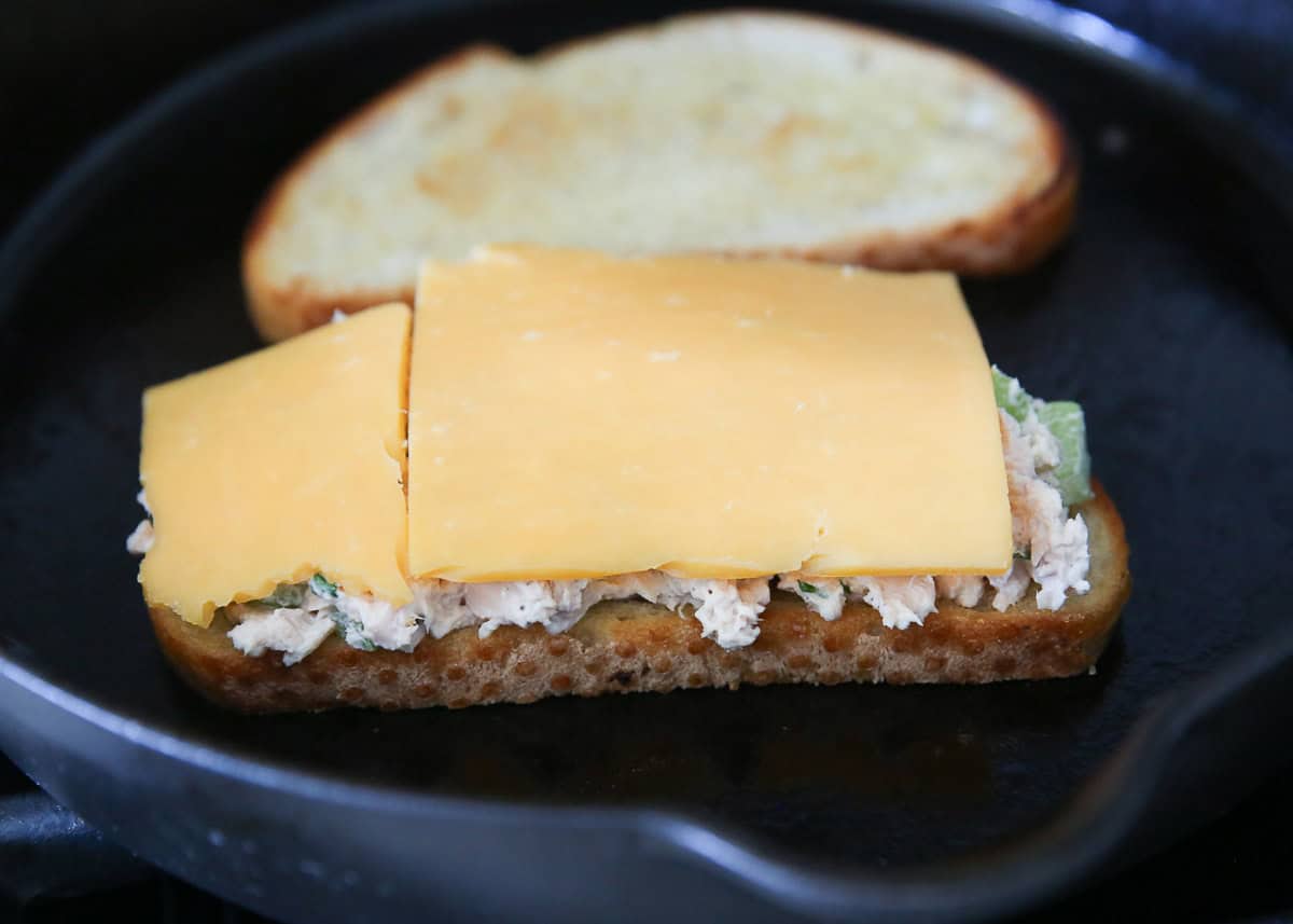 Showing cheese on a tuna melt.