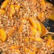 Peach crisp in cast iron skillet.