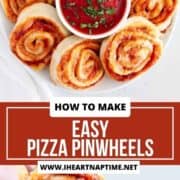 pizza pinwheels on a plate and being dipped in sauce