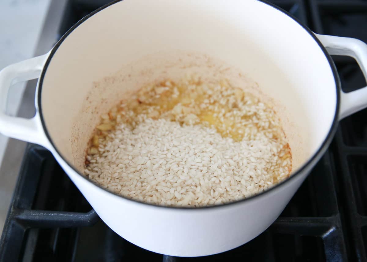 Coating rice in butter.