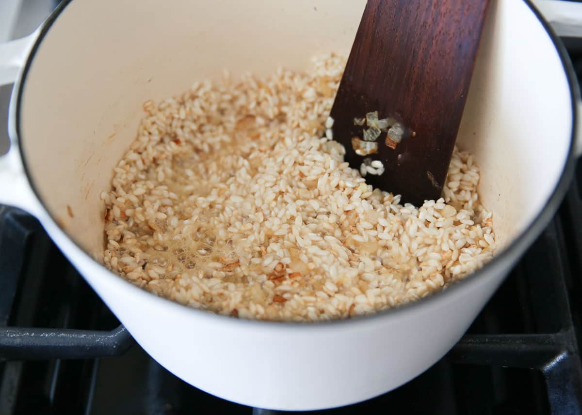 Stirring wine into risotto.