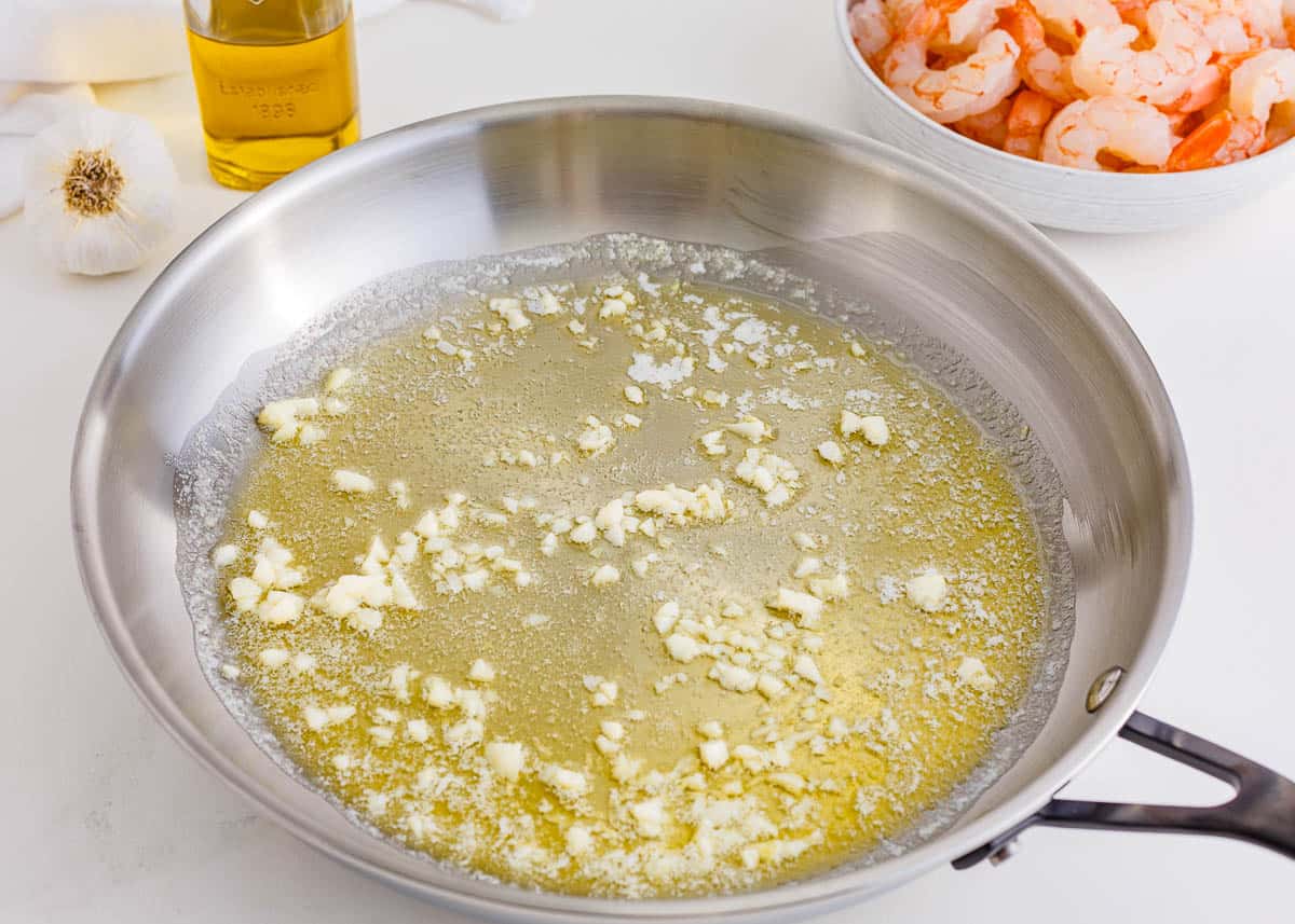 Butter and olive oil being warmed in a skillet.