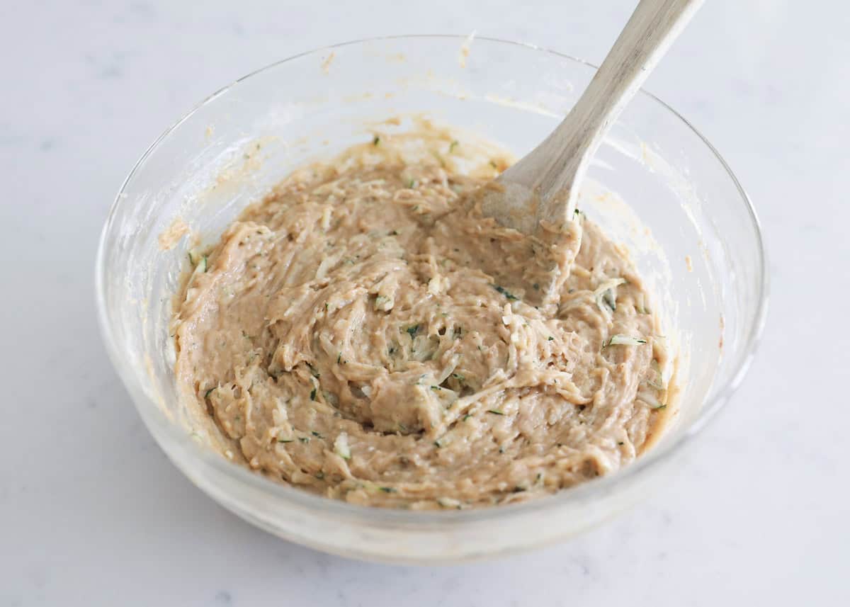 Zucchini muffin batter in a bowl.