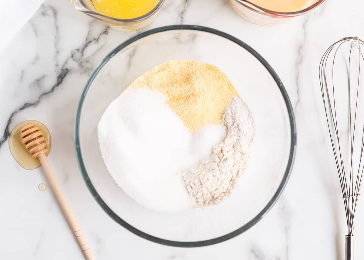 Cornmeal, flour and sugar in a bowl.