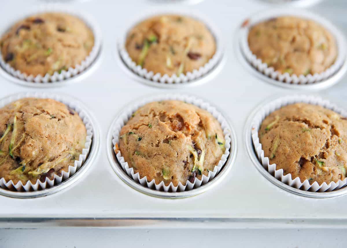 Zucchini muffins in muffin tin.