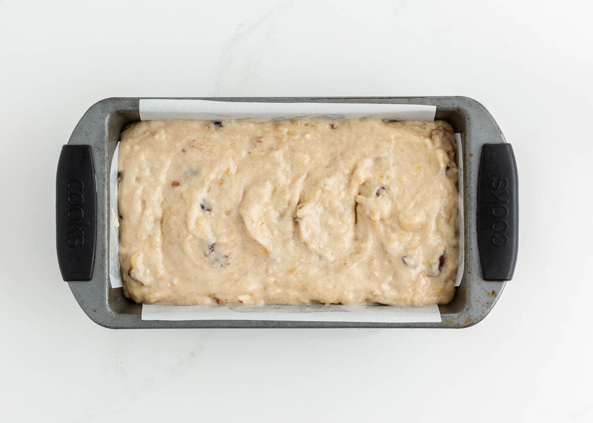 Unbaked banana nut bread in a loaf pan.