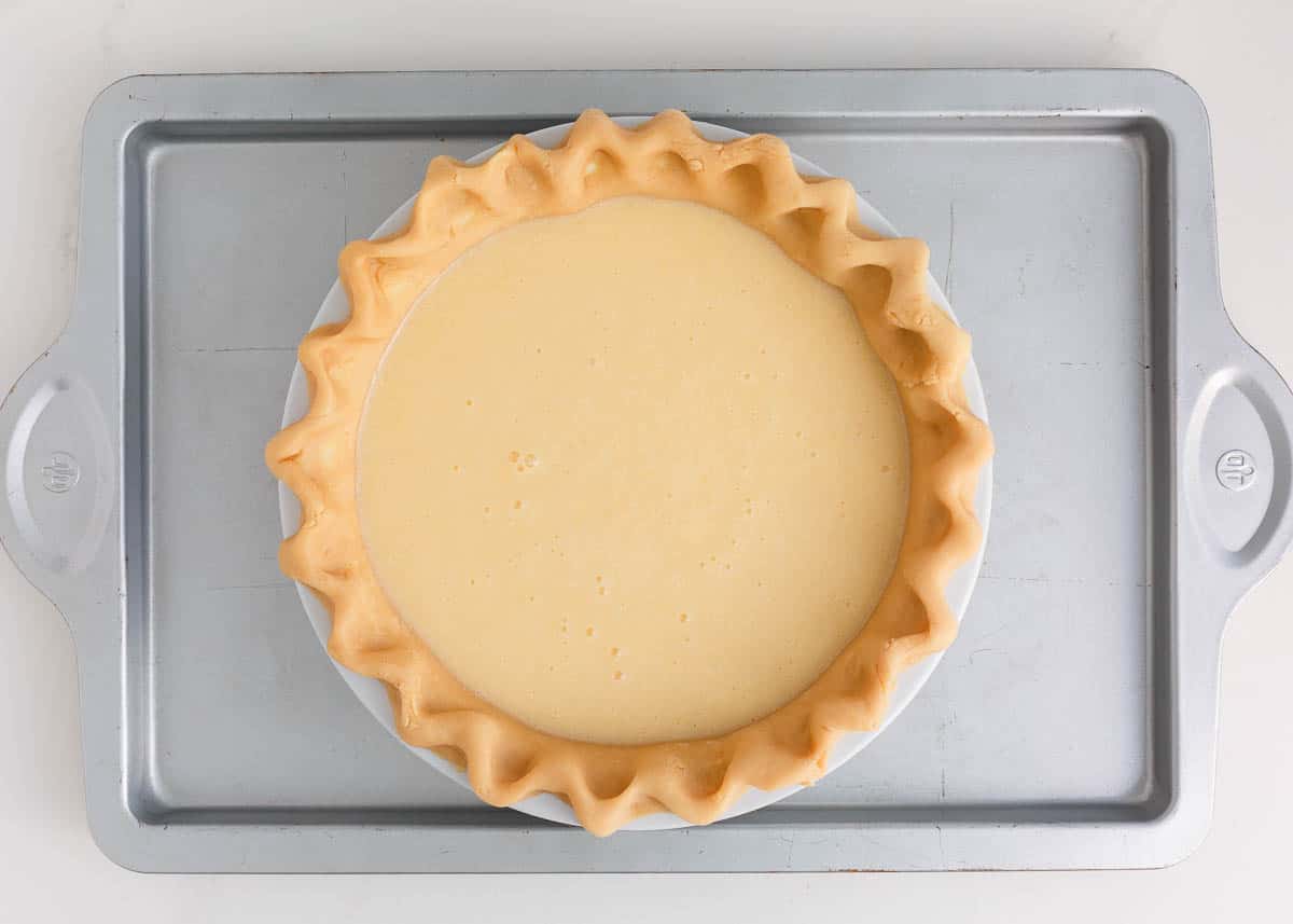 Buttermilk pie filling in a pie crust.