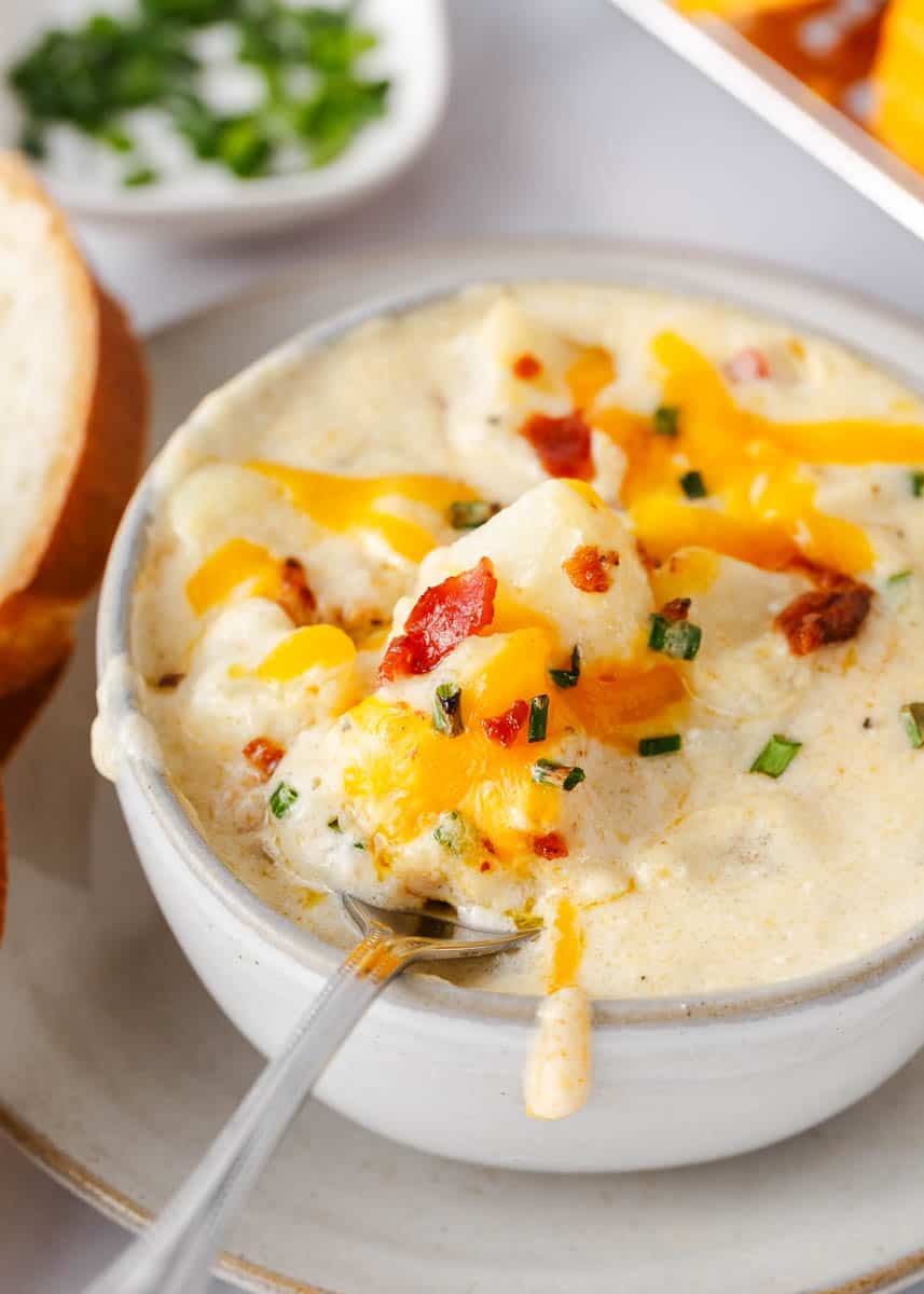 Loaded baked potato soup in a bowl topped with cheese and bacon.