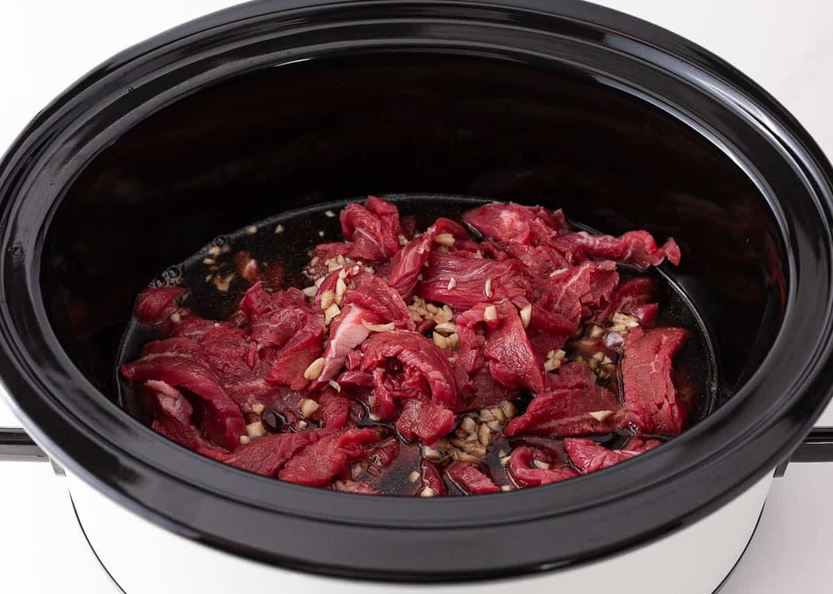 Strips of beef in a crockpot. 