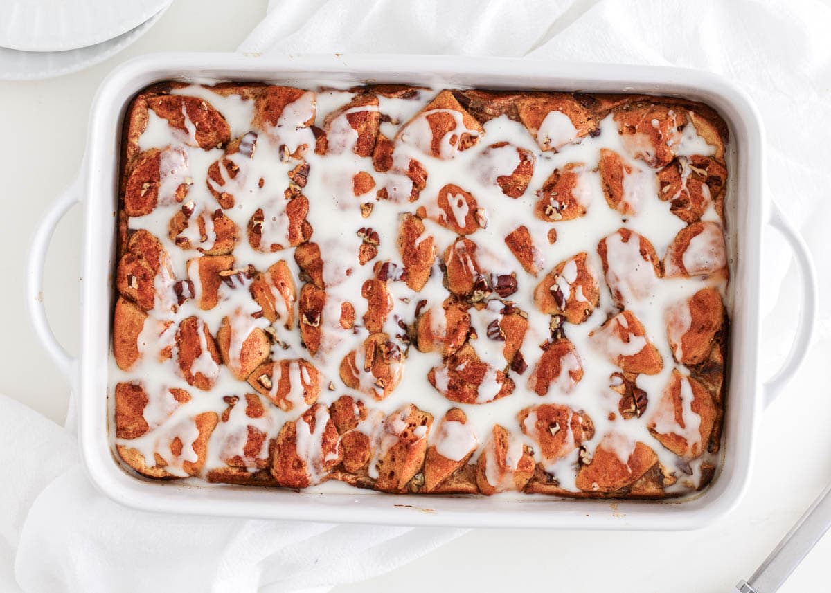 Cinnamon roll casserole in white baking dish.