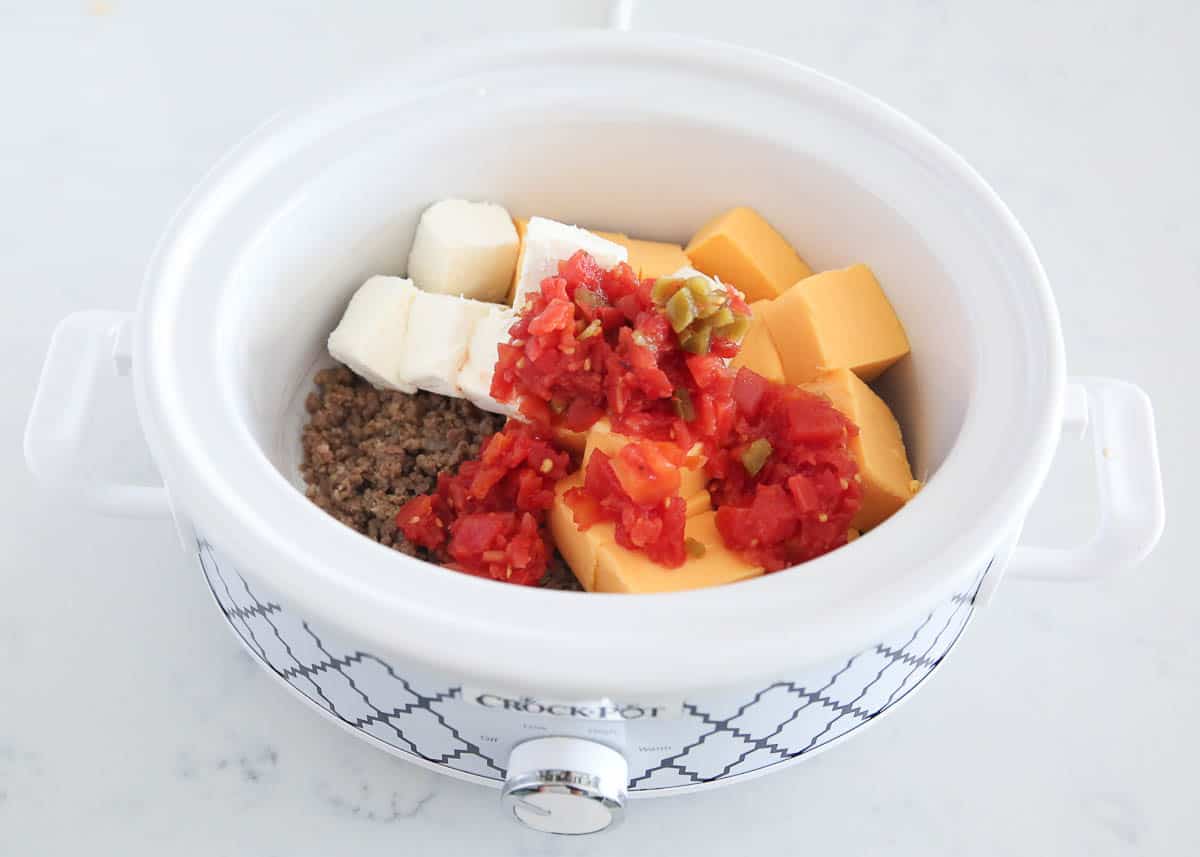 Sausage, velveeta, Rotel and cream cheese in a slow cooker.