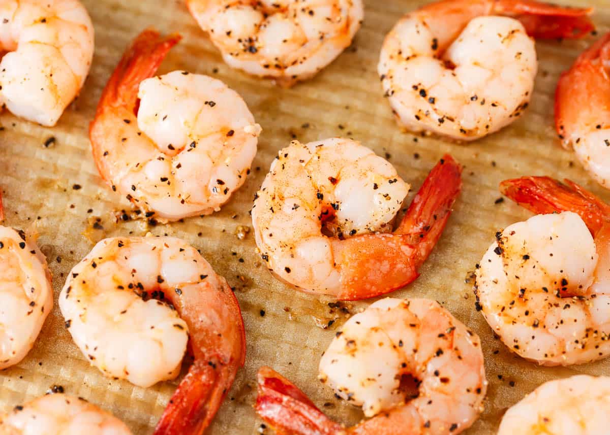 Baked shrimp on a baking sheet.