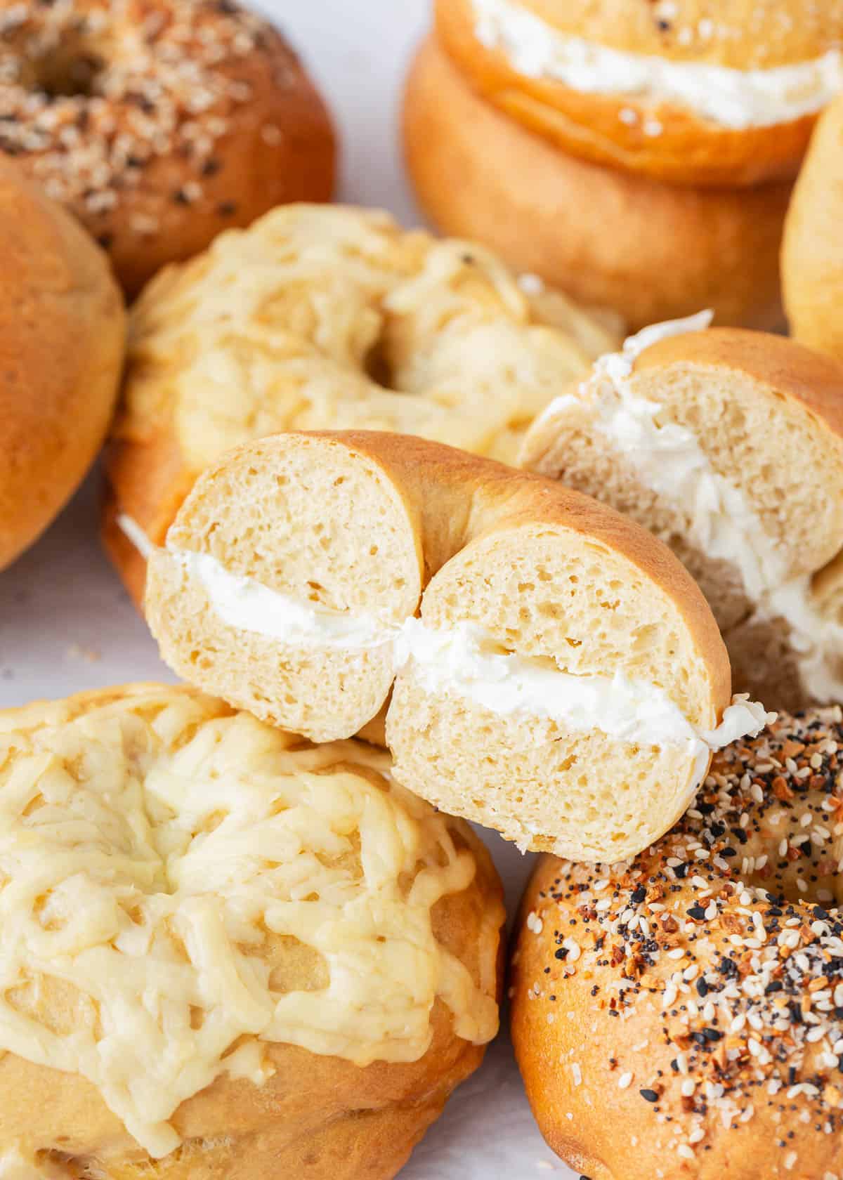 Stack of bagels with cream cheese.