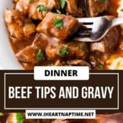 Beef tips and gravy with mashed potatoes in a bowl with a fork.